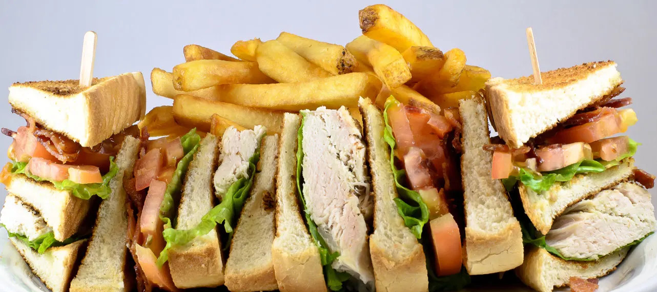 Club sandwich with fries